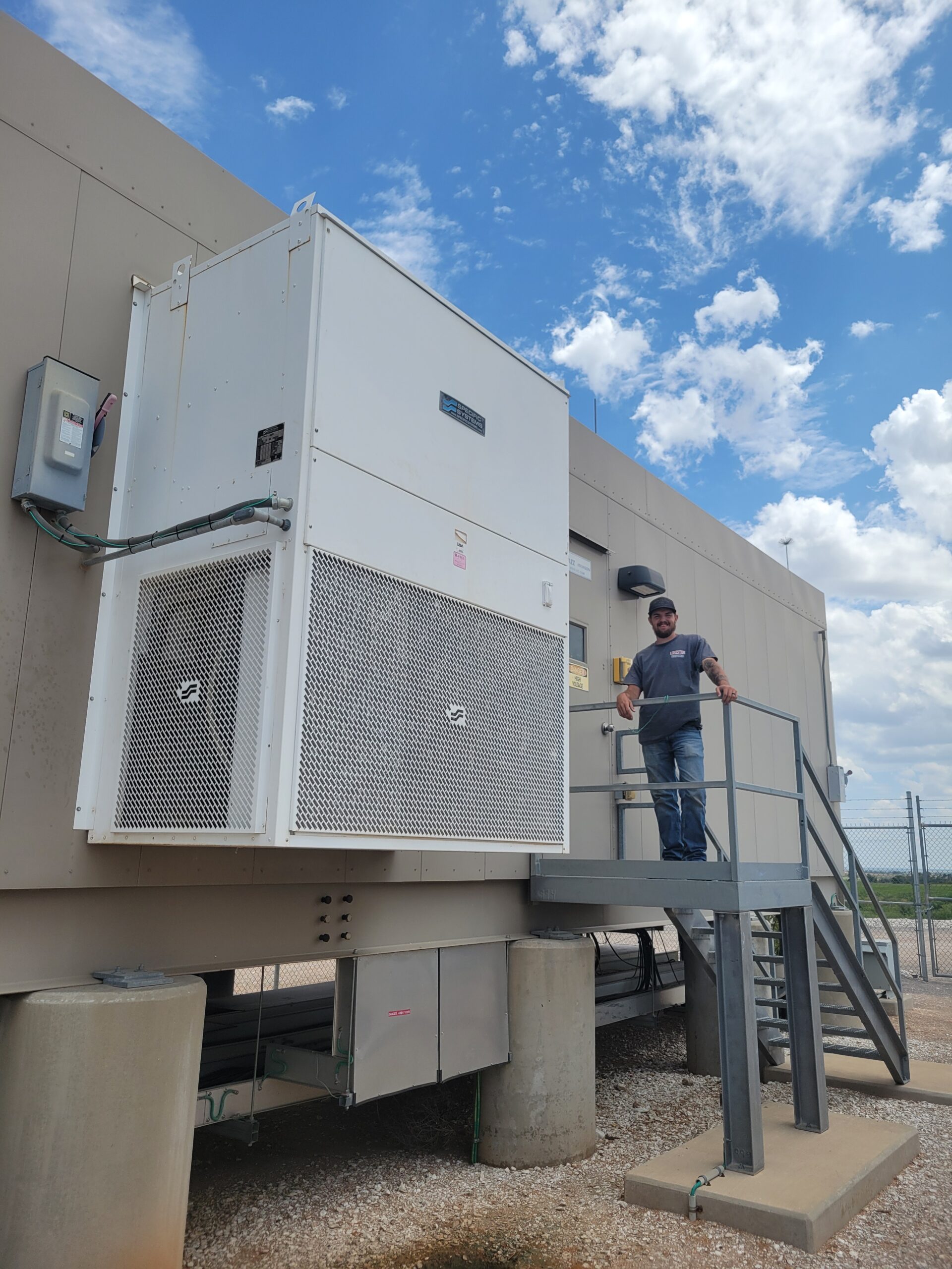 Lonestar Services technician on a rooftop mechanical unit
